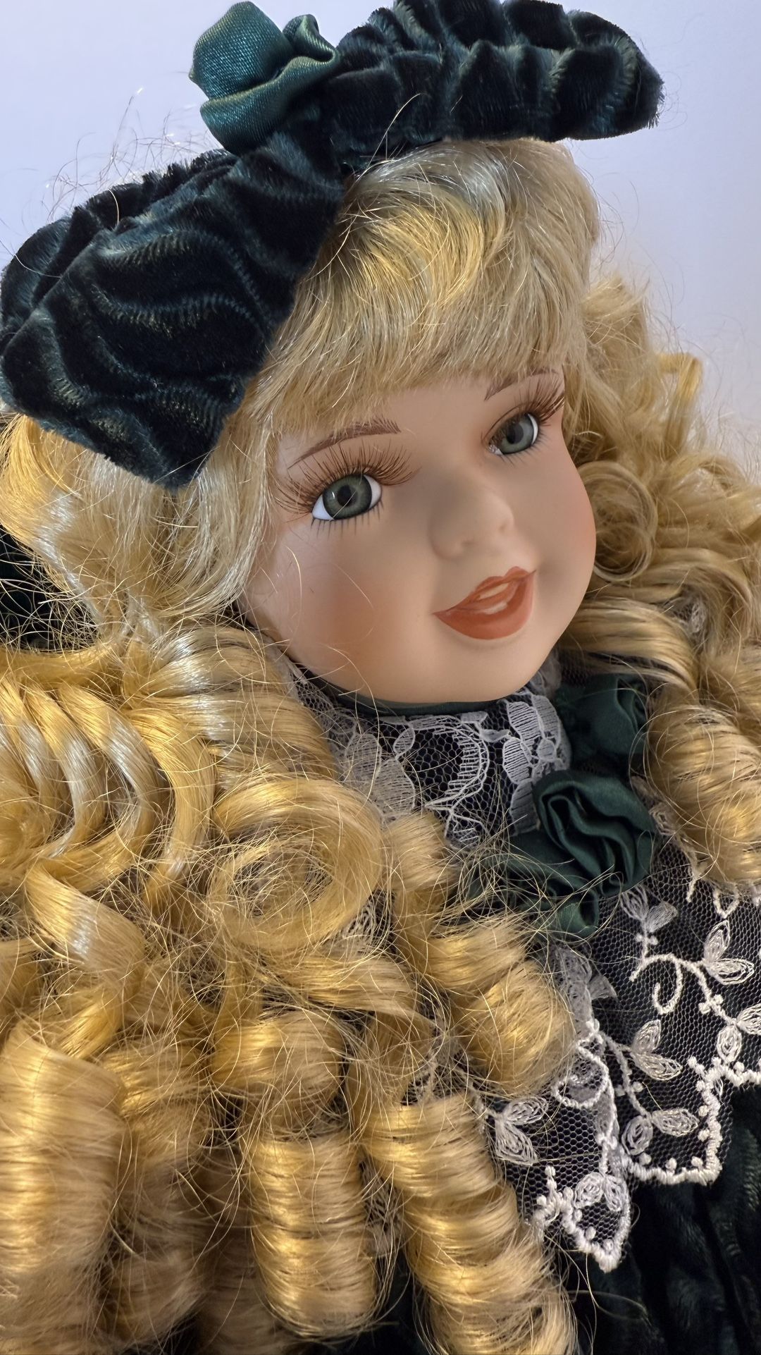 Vintage Porcelain Doll Blonde Curly Hair Green Velvet Dress on Chair Collectible