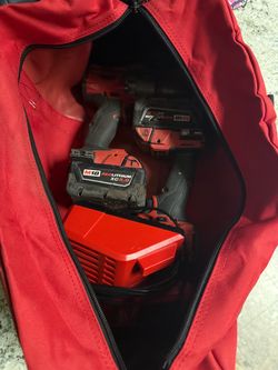 Used M18 Milwaukee Fuel Brushless Impact and Hammer Drill with charger and Husky tool bag