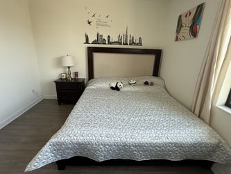 Bed, mattress, nightstand, and cabinet.