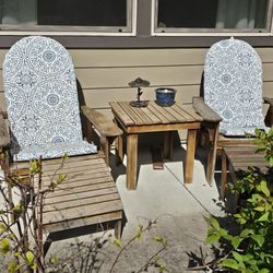 two adirondack chairs w/ ottomans table and cushions