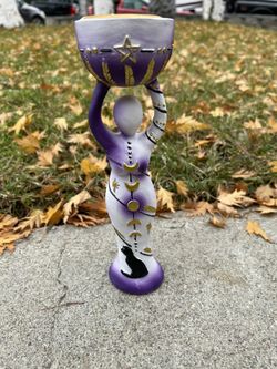 Doll Holding Small Candle