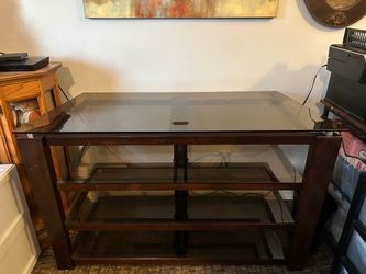 Wood TV Stand, Glass Top with 3 glass shelves. 2’ 6” Height - 4’ 2” Length - 1’ 9 1/2” Depth.