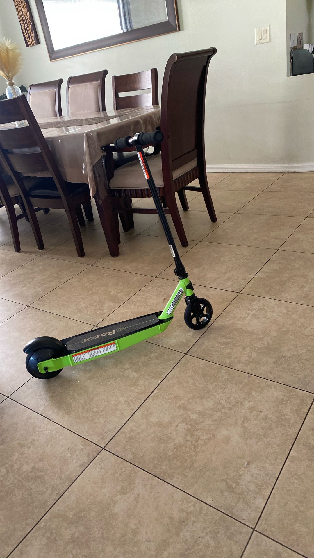 All green Razor little scooter