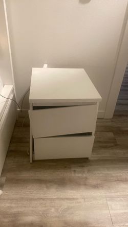 2-drawer white nightstand that needs reassembly