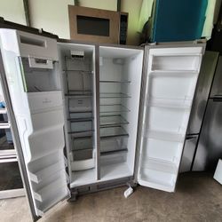 A 2-door refrigerator measuring 36 inches wide by 69 inches high by 28 inches deep, Whirlpool brand