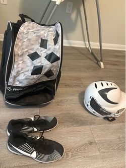 SOFTBALL CLEATS, BAG, AND BATTING HELMET