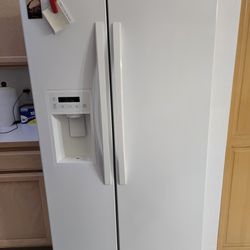 Kenmore side-by-side refrigerator with ice & water dispenser
