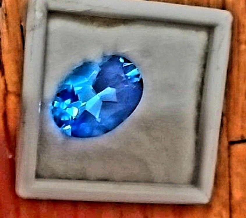 Oval shaped blue topaz gemstone