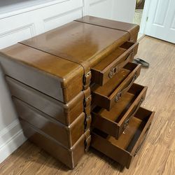 Custom chest of drawers in the shape of stacked suitcases