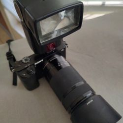 ony Alpha a6000 Mirrorless Digital Camera w/ 16-50mm and 55-210mm Power Zoom Lenses Black