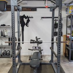 FULL GYM SET: Power rack with barbell, weights, bench, rack, and mats