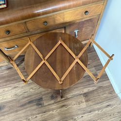 The VTG 10 Peg Wooden Accordian Style Folding Expandable Hat or Coat Rack is a vintage-style wall-mounted coat and hat rack made of brown wood. It fea