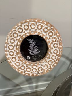 Handcrafted round picture frame made of wood with a white-washed carved design 4x4