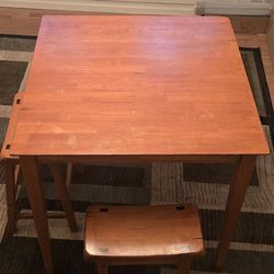 Bar height wood table with stools