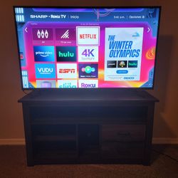 55" SHARP ROKU TV WITH REMOTE AND A TV STAND
