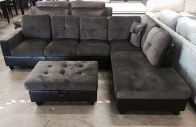 Dark gray microfiber sectional couch and ottoman
