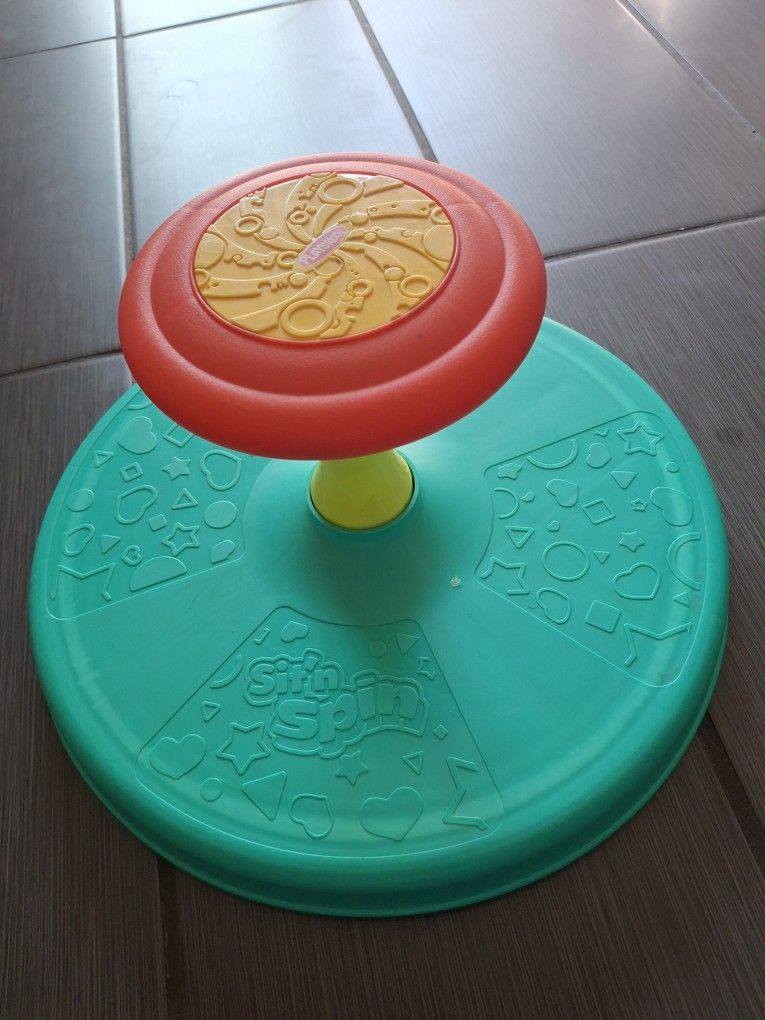 The Spin Toy brings excitement with its vibrant red, yellow, and green design. Ideal for active play, it promotes movement and coordination. A must-ha