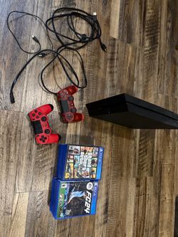 PS4 with 2 controllers and 16 games