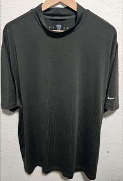 Vintage Nike Golf dark green pinstripe mock neck short sleeve shirt features a subtle vertical stripe pattern and the iconic white Swoosh logo on the 