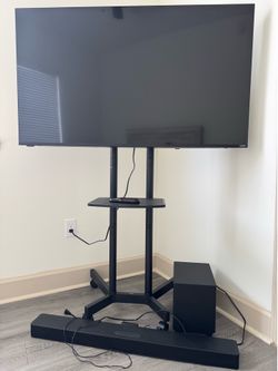Tv with tv stand and sound speaker