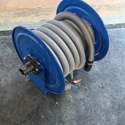 Metal hose reel and vacuum hose