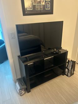 43” LG 4K Smart TV (2022) + Black Glass TV Stand