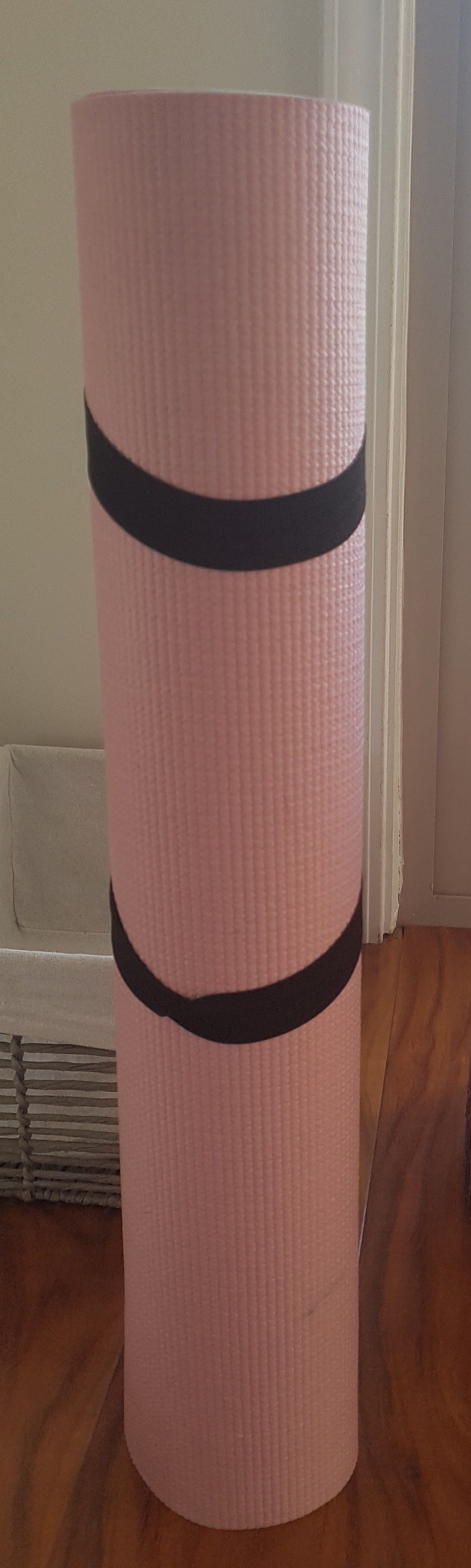 Pink yoga mat with strap holder