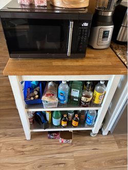 Kitchen island with 2 shelves and butchers block