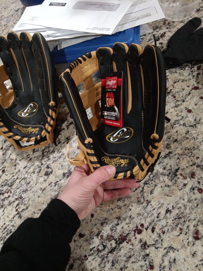 Two Pairs Or Rawlings Player Series Catcher Gloves