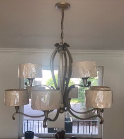 Almost new chandelier....6 lights brushed nickel.......