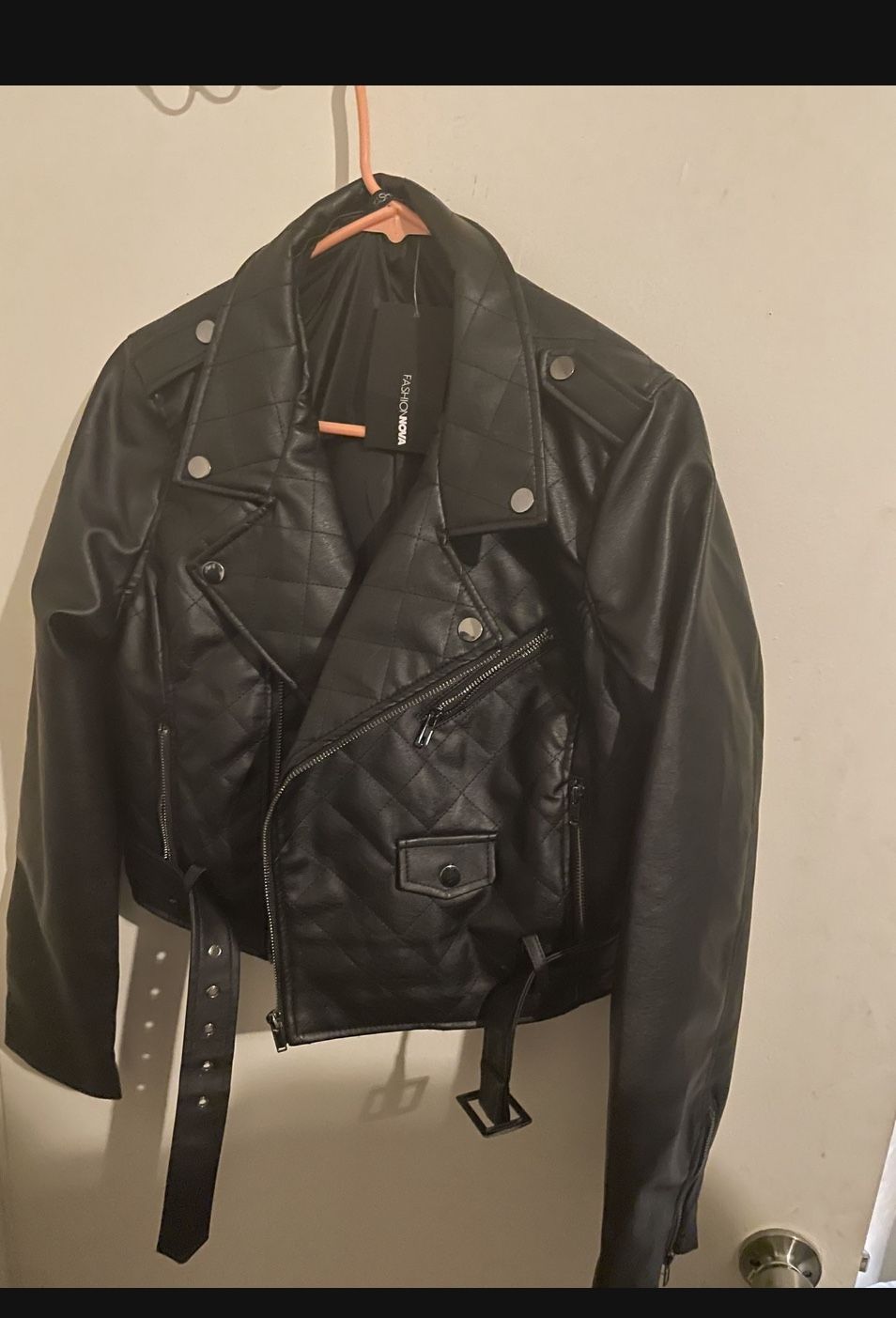 Woman’s Black Leather And Levis Jean Jacket 