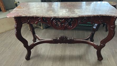 Hand carved table. Marble top