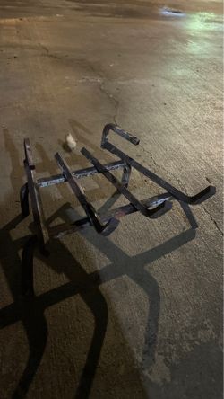 Iron fireplace log rack