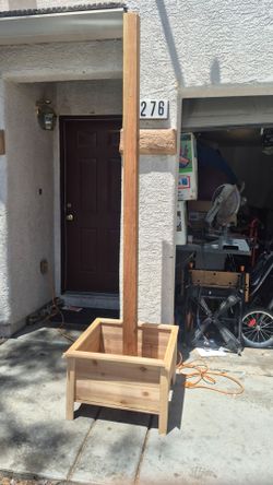 Raised planter with post for lights
