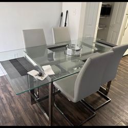 Modern glass dining table with 4 chairs
