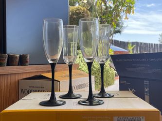 Champagne glasses with black stems
