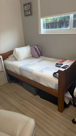 Wood Twin bed with a new mattress