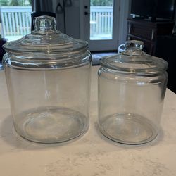 2  round glass canister’s