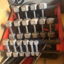 Set of metal barbells with Red rack 800$$ obo no low ball