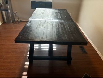 Dark solid wood dining room table