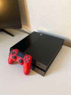 PlayStation 4 with controller and games