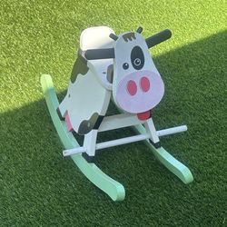 Wooden cow swing