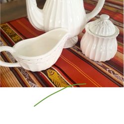 Porcelain set: pitcher, sugar bowl, creamer.