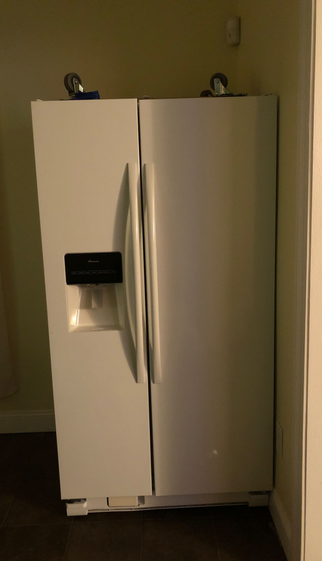 White Amana double door refrigerator 68” H 36”W31” D with doors