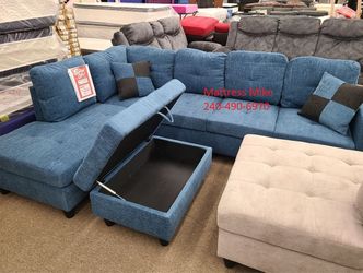 New in box blue color sectional with ottoman and pillows
