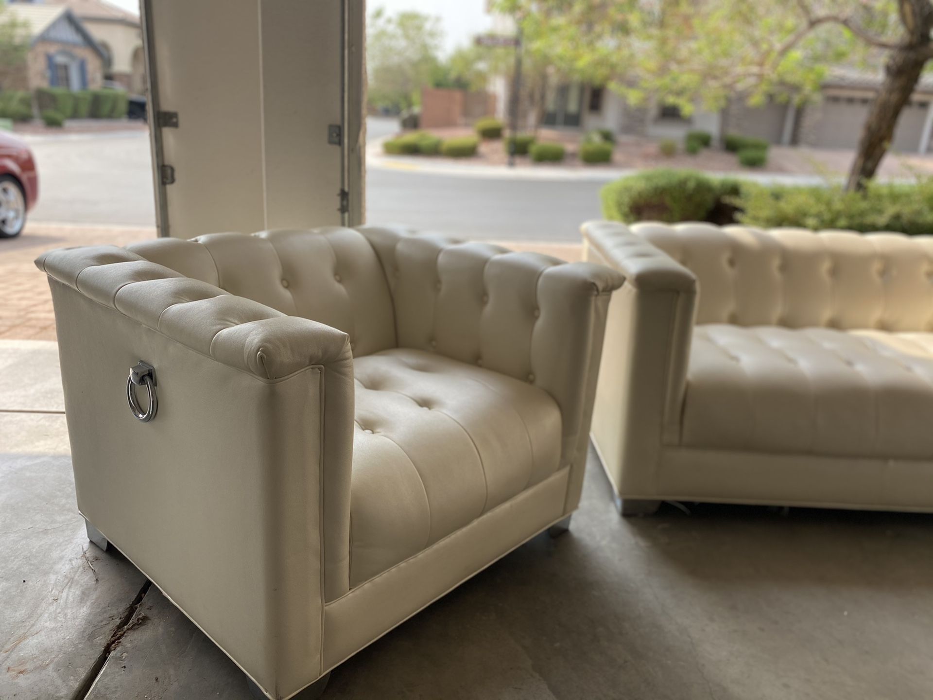 White leather couch and seat with leather ottoman