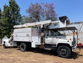 Lift truck and chipper for sale.