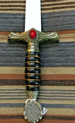 Ceremonial object, possibly a cane or scepter handle featuring a Russian Imperial Eagle emblem. We