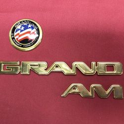 Grand AM Badges gold Olympic Edition. 