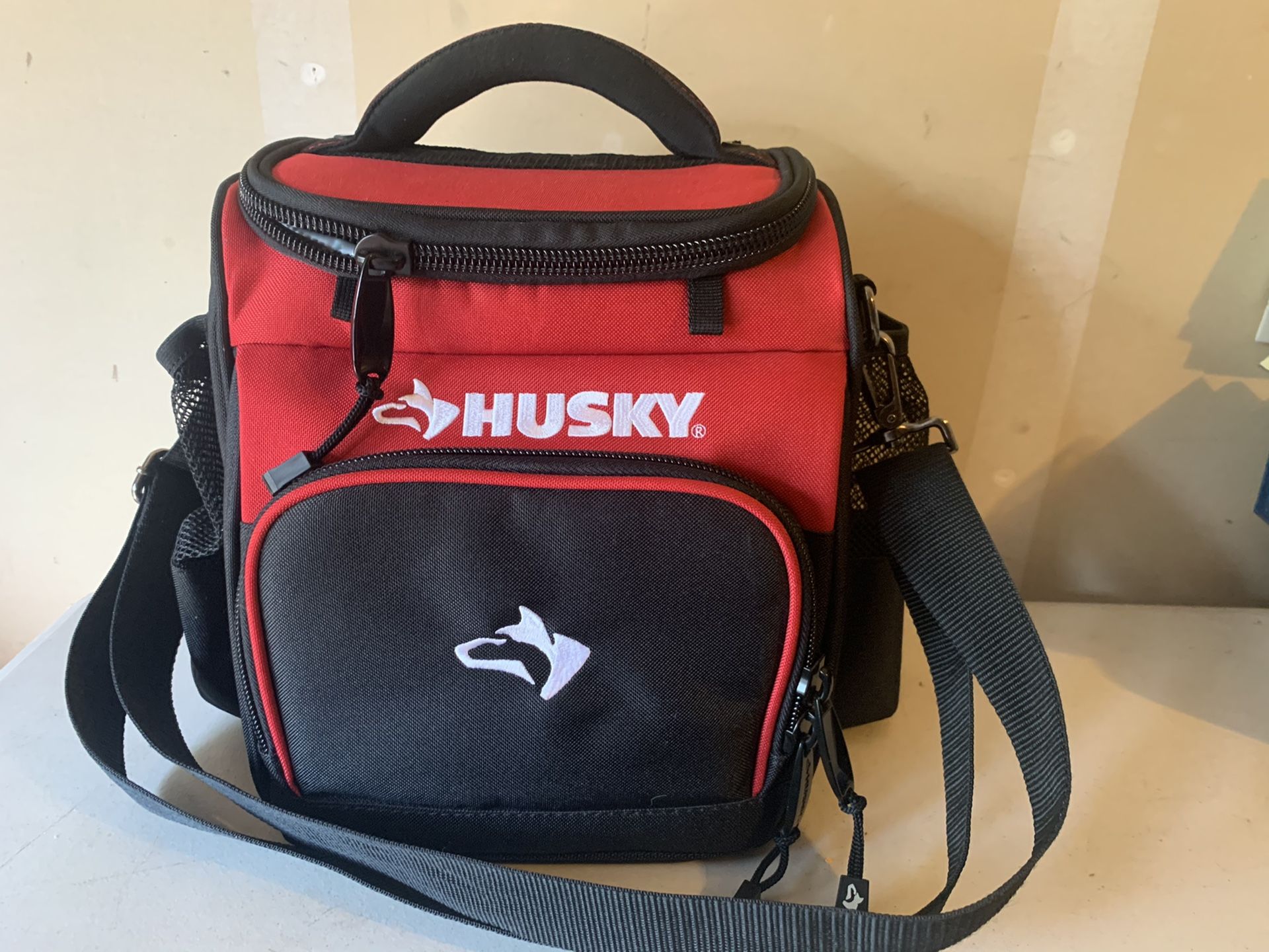 Husky-water and weather resistant insulated cooler.